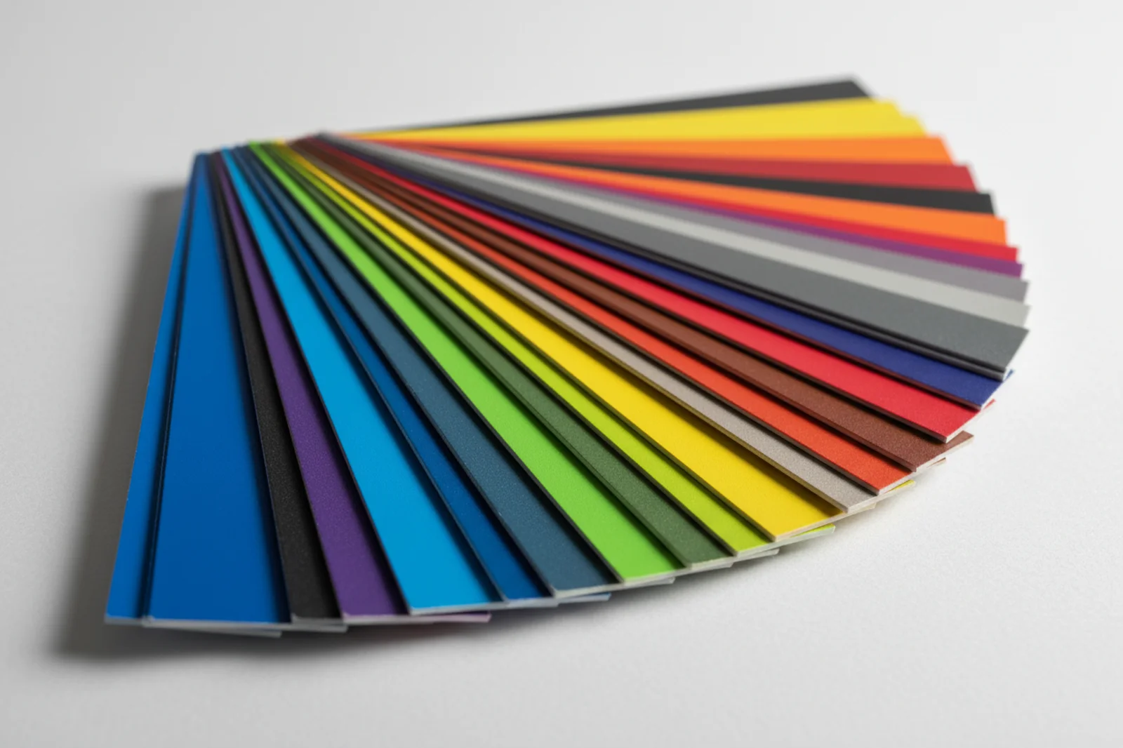 Powder coating colour fan deck spread in an arc showing the range of shades